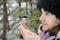 Chickadee and A Beautiful Woman Stock Photo. Chickadee on hand Stock Photo. 