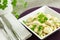 Chicken Aldredo garnished with flat leaf parsley, horizontal