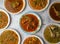 chicken or beef red karahi, daal moong, mash, chana, channay, korma, nihari, fry, makhni, qeema,white karahi served in a plate