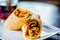 Chicken breast with piri piri sauce and lettuce in a chili tortilla wrap