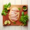 Chicken breasts and celery on a cutting kitchen wooden board