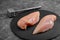 Chicken breasts, raw chicken fillet Photo for a store with natural products. Food delivery, gray background. copies of