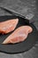 Chicken breasts, raw chicken fillet Photo for a store with natural products. Food delivery, gray background. copies of