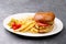 Chicken burger plate with french fries and salad