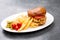 Chicken burger plate with french fries and salad