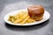 Chicken burger plate with french fries and salad