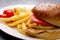 Chicken burger plate with french fries and salad