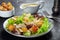 Chicken Caesar salad with the classic dressing, croutons, and pepper