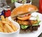 Chicken cajun burger with salad and soda