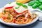 Chicken caprese with tomato and mozzarella cheese, served with linguine, tomato sauce and basil, horizontal, closeup