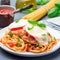 Chicken caprese with tomato and mozzarella cheese, served with linguine, tomato sauce and basil, square format