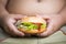 Chicken cheese Hamburger on obese fat boy hand