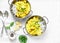 Chicken coconut milk curry sauce with rice on a light background, top view. Indian style