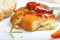 Chicken cordon Bleu on plate with tomato sauce or ketchup and br