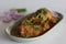 Chicken curry prepared by chicken in cashew gravy garnished with fresh coriander leaves