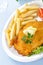 Chicken cutlet with chips, closeup