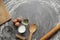 Chicken egg, flour, olive oil, milk, kitchen tool on gray table background