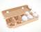 Chicken eggs in a cardboard tray isolated on a white