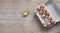 Chicken eggs in carton on wooden table. Eggs Yolk Cooking Top View