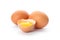 Chicken eggs and half broken egg with yolk  isolated