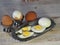 Chicken eggs on a wooden rustic white table. Purified and unpeeled. Shells. Preparing a filling for pies. Homemade food