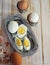 Chicken eggs on a wooden rustic white table. Purified and unpeeled. Shells. Preparing a filling for pies. Homemade food