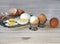 Chicken eggs on a wooden rustic white table. Purified and unpeeled. Shells. Preparing a filling for pies. Homemade food