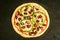 Chicken Fajita Pizza isolated on wooden background, spiced chicken cubes and cheese combination on bread, Italian food top view