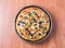 Chicken Fajita Pizza isolated on wooden background, spiced chicken cubes and cheese combination on bread, Italian food top view