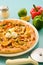 Chicken Fajita Pizza isolated on wooden background, spiced chicken cubes and cheese combination on bread, Italian food top view