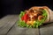 Chicken fajita wrap sandwich. Sandwich with fajita chicken. Roll with chicken meat fresh tomatoes and cucumbers, lettuce