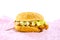 Chicken fried burger on pink paper