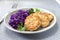 Chicken fritters and stewed red cabbage with caraway