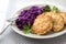 Chicken fritters and stewed red cabbage with caraway seeds