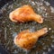 Chicken frying in a pan