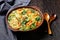 Chicken kale veggies soup in a bowl