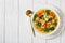 Chicken kale veggies soup in a bowl