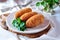 Chicken Kiev cutlets with parsley leaves. Ukrainian tradition food.