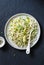 Chicken, leek, linguine pasta carbonara on a dark background, top view