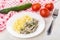 Chicken liver with pasta in plate, cucumber, tomatoes, napkin, f