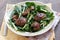 Chicken liver and spinach salad with green apple and onion