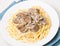 Chicken livers in a creamy sauce with spaghetti