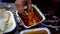 Chicken masala served in a foil container, accompanied by fresh bread in Delhi