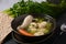 Chicken Matzo ball soup with carrots in the bowl.