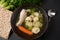 Chicken Matzo ball soup with carrots in the bowl.