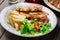 Chicken medallions with red peppers served with chips