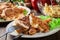 Chicken medallions with red peppers served with chips