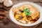 Chicken mussaman curry in bowl and herb