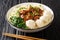 Chicken Noodle Meatballs Mie Ayam Bakso closeup in the bowl. Horizontal