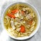 Chicken noodle soup carrot hearty dish fussili pasta onion celery